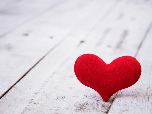 Close up soft red heart shape on white old wood background. - Φωτογραφία, εικόνα