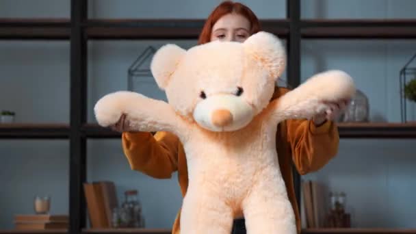 happy teenage girl having fun with big teddy bear - Filmati, video