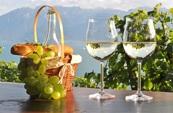 Wine and grapes against Geneva lake. Lavaux region, Switzerland - Photo, Image