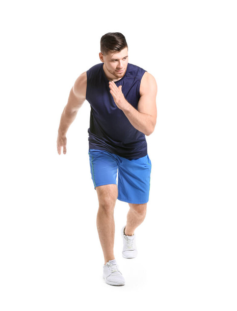 Sporty running young man on white background - Foto, Imagem