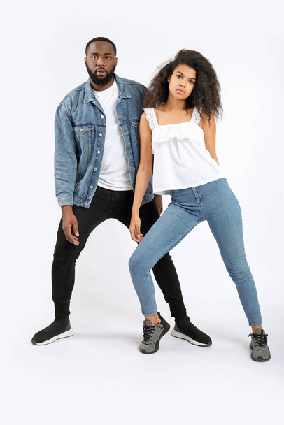 Portrait of stylish young African-American couple on white background - Fotografie, Obrázek