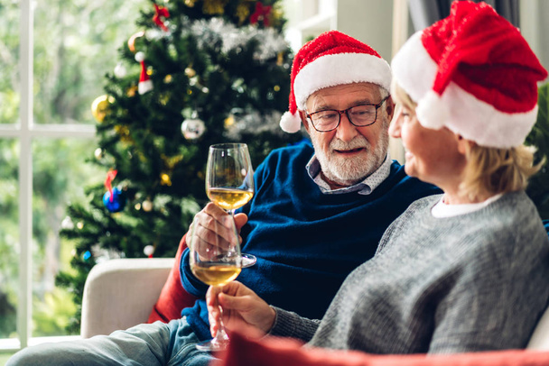 Senior couple relax talking and drinking wine glasses together o - 写真・画像