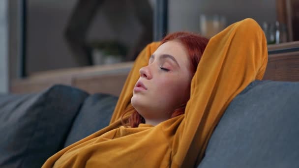 exhausted teenage girl sitting with hands behind head - Felvétel, videó