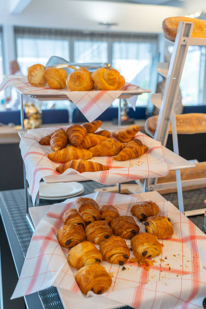 Tasty traditional European pastry on decorated shelf at bakery - Fotografie, Obrázek