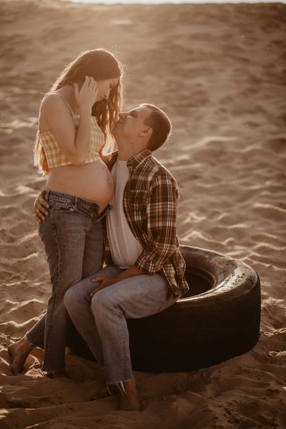 young beautiful couple, pregnant woman with husband posing outdoors  - Photo, Image