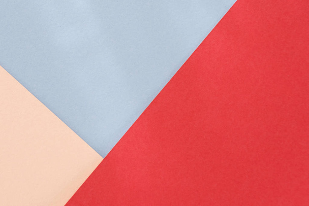 Red blue beige paper background. Geometric figures, shapes. Abstract geometric flat composition. Empty space on monochrome cardboard. - Foto, imagen