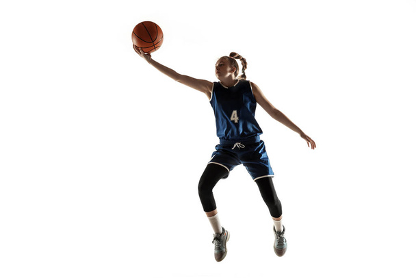 Young caucasian female basketball player against white studio background - Фото, зображення