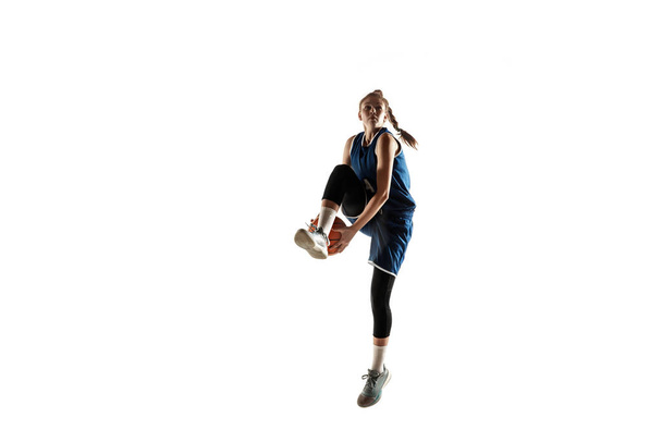 Young caucasian female basketball player against white studio background - Fotoğraf, Görsel