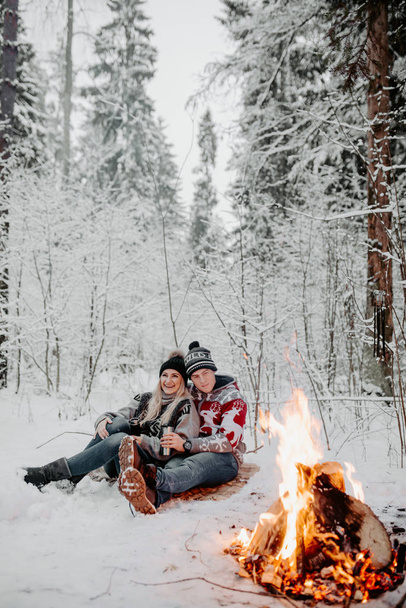 happy couple enjoying in the snowy winter forest . Christmas mood.   - Fotó, kép