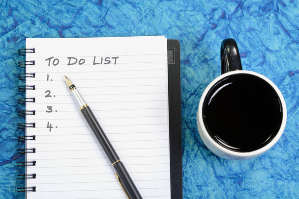 To Do List written on a book with pen and coffee cup - Photo, image