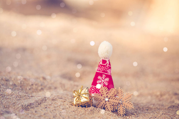 Santa hat on the beach sand  - Photo, Image