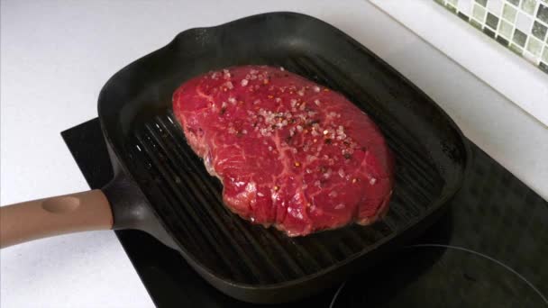 Chef Throws a Twig of Rosemary on Grilled Beef Steak on Grill Pan - Video, Çekim