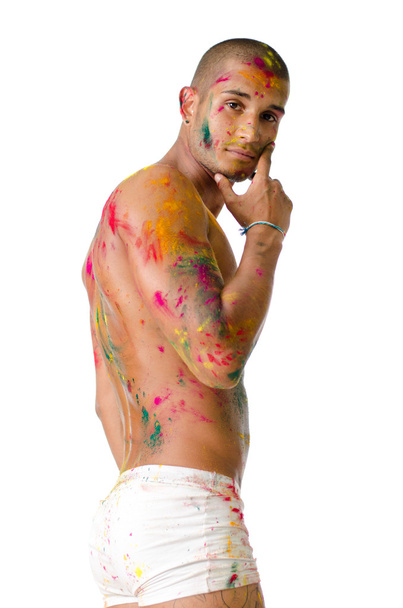 Handsome young man with skin all painted with Honi colors - Foto, afbeelding