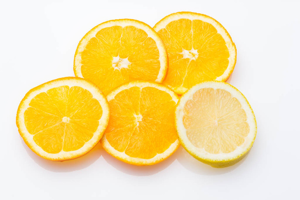 Oranges and lemons, citrus fruits - Photo, image