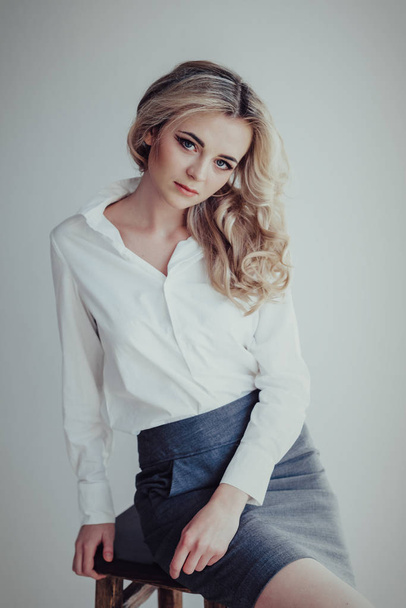Portrait of a beautiful blonde girl in a business suit - Fotografie, Obrázek