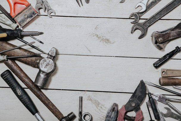 construction hammers screwdriver repair tool pliers on the board - Foto, Bild