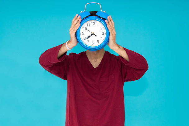 man with alarm clock or alarm isolated on color background - Photo, Image