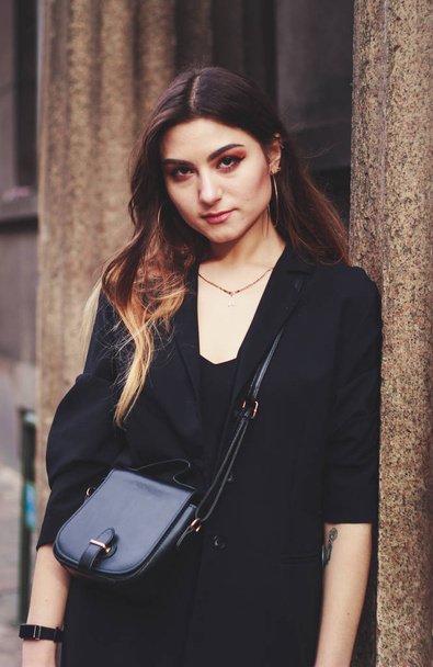 Model in black dress and long jacket. Style. Fashion trends 2020 - Foto, Imagen