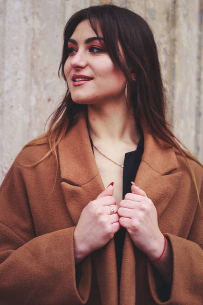 Model in black dress and long brown coat. Trench. Style. Fashion - Foto, Bild
