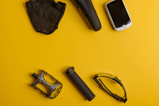 Bicycle, Cycling accessories on the yellow background. view from - Photo, Image