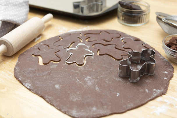 Top view of cooking process, festive Christmas gingerbread chocolate cookies. Cooking chocolate cookies or dessert. - Foto, imagen