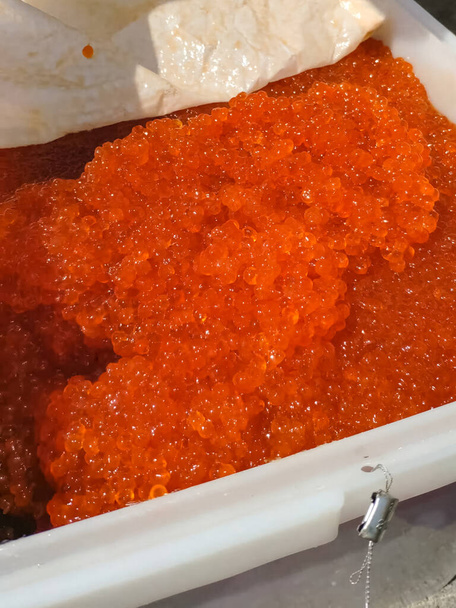 Fresh red caviar in open container. - Photo, Image