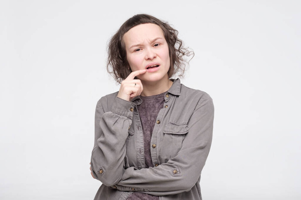 Puzzled european young woman thinking about life choices. - Photo, Image