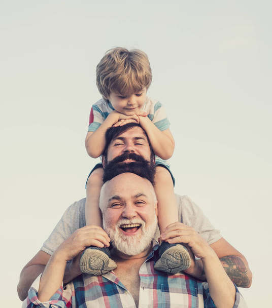 Childhood concept. Family holiday and togetherness. Male multi generation family. - Фото, зображення