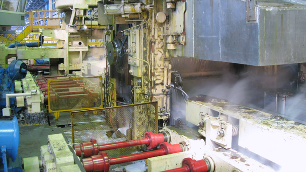 Pressing machine works in production shop of rolling mill - Footage, Video
