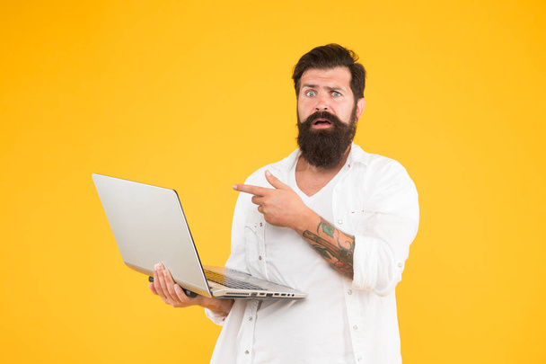 what is that. agile business concept. education in digital world. Programmer with computer. brutal man surfing internet. hipster use notebook. Bearded man laptop yellow background. shopping online - Фото, изображение