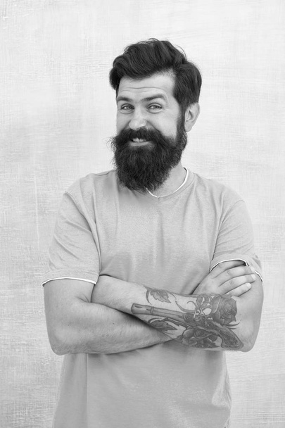 Be casual be yourself. Happy hipster in casual outfit keeping arms crossed. Bearded man smiling in casual style isolated on white. Casual and comfortable - Fotografie, Obrázek