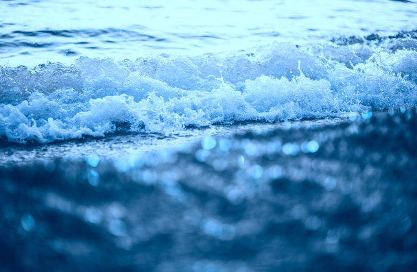 Blue sea waves closeup view. Color of the year 2020. - Foto, Imagen