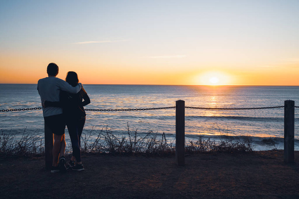 Pismo Beach, California/USA - November 24, 2019  Summer romantic sunset. Couple on the beach.  - Photo, Image