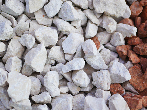 gray little pebbles. Background consists of small gray pebbles. With many possible uses. The texture consists of tiny pebbles of a gray hue. - Photo, Image