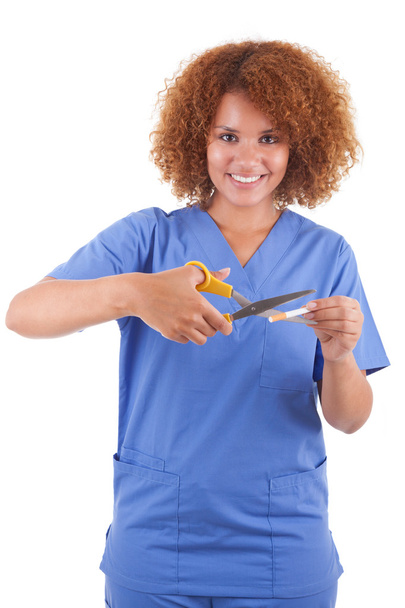 African American nurse cutting a cigarette with scissors - Bla - Foto, Imagem