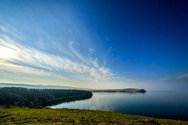 Russia, Lake Baikal, Olkhon Island, Clouds and Stars on the Smal - Photo, Image