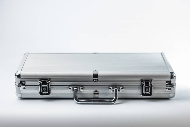 Metallic suitcase on white background - Фото, изображение