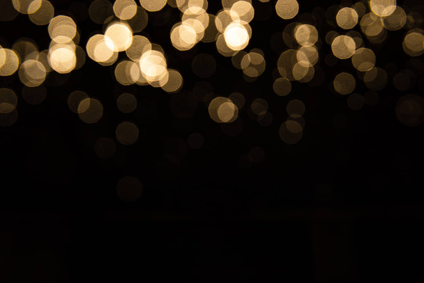 Abstract gold bokeh with black background - Fotografie, Obrázek