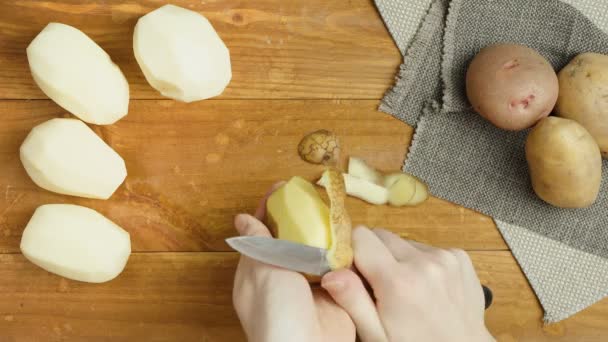Video of preparing potato on wooden board - Footage, Video