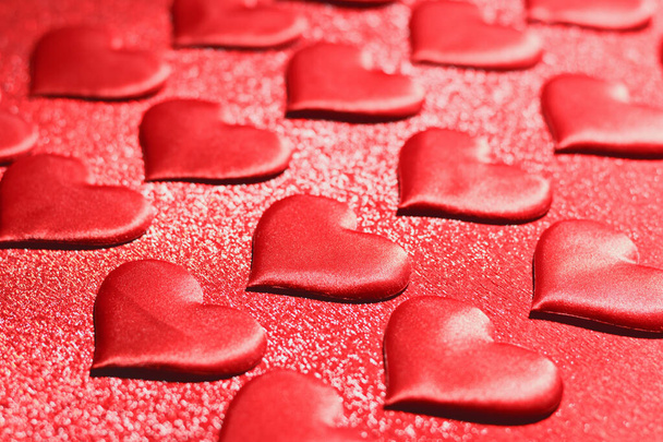 Many red hearts on a red background. Romantic love, Valentine's  - Fotografie, Obrázek