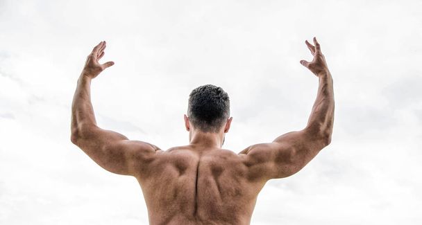 Sport motivation. Champion and winner concept. Man celebrating success. Bodybuilder strong muscular back feeling powerful and superior. Achieve success. Successful athlete. Victory and success - 写真・画像