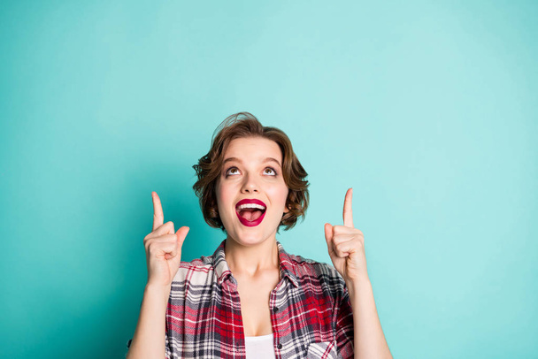 Close up photo of amazed excited girl point index finger up direct adverts promo recommend sales discount wear good looking clothing isolated over teal color background - Фото, зображення