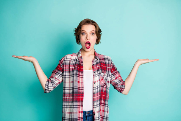 Portrait of astonished girl promoter present unbelievable unexpected promotion adverts stare stupor scream wow omg wear stylish outfit isolated over teal color background - Foto, Imagen