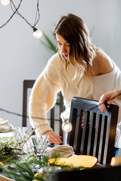 beautiful woman prepares all for Christmas dinner - Photo, Image