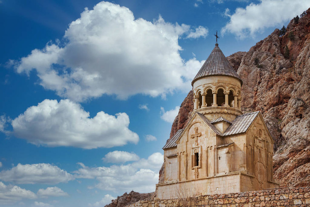 Scenic Novarank monastery in Armenia. Noravank monastery was founded in 1205. It is located 122 km from Yerevan in a narrow gorge made by the Darichay river nearby the city of Yeghegnadzor - Fotoğraf, Görsel