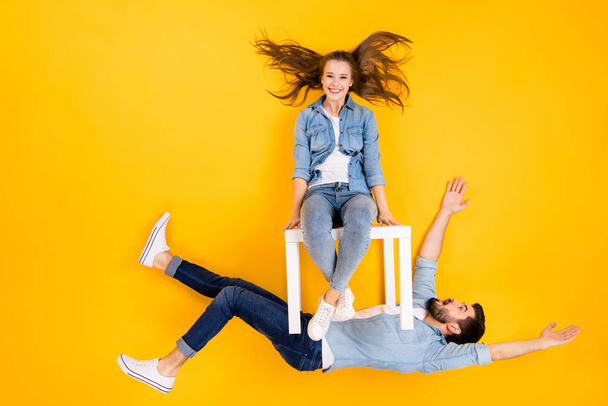 Top view above high angle flat lay flatlay lie view concept of her she his he nice partners girl sitting on stool guys chest psychology isolated on bright vivid shine vibrant yellow color background - Fotografie, Obrázek