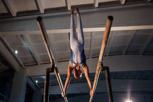 Little male gymnast training in gym, flexible and active - Φωτογραφία, εικόνα