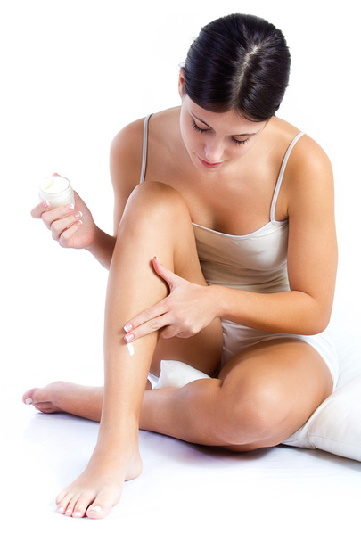Woman applying cream on body - Foto, imagen