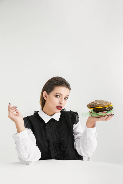 We are what we eat. Womans eating plastic food, eco concept - Photo, image