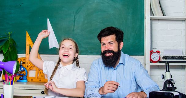 Teacher and schoolgirl. Man bearded pedagogue and pupil having fun. Developing caring learners who are actively growing and achieving. School learners leisure. Creating a community of learners - Fotografie, Obrázek